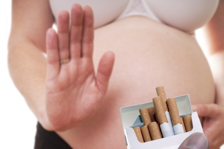 pregnant woman rejects cigarettesの写真素材