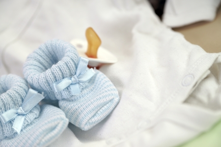 Baby Shoes and Pacifierの写真素材