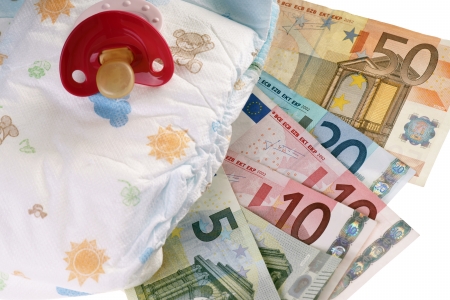 Baby diapers with pacifiers and euro moneyの写真素材