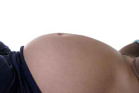 pregnant woman with naked bellyの写真素材