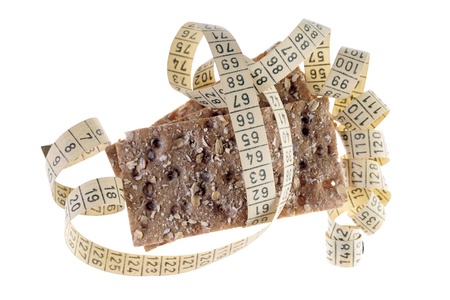 Whole grain crispbread with tape measureの写真素材