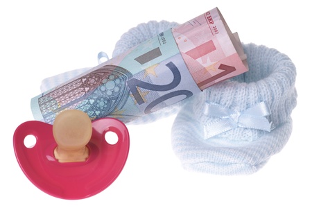 baby shoes with pacifier and euro moneyの写真素材