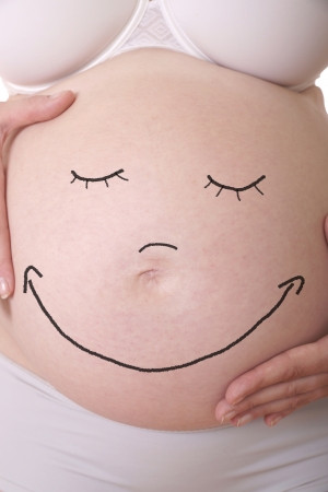 pregnant woman with laughing bellyの写真素材