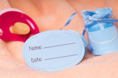 little baby shoes to the birth with pacifierの写真素材