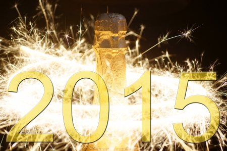Champagne bottle with fireworks and the year number 2015