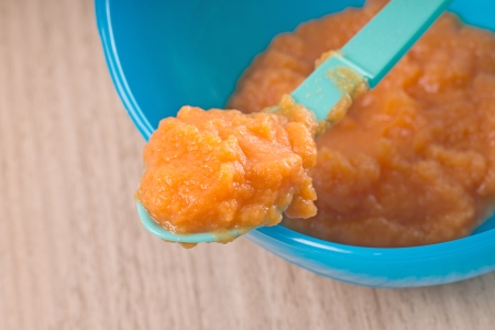 Baby food in a porridge bowlの写真素材