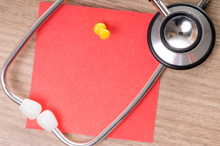 Stethoscope with an empty piece of paperの写真素材