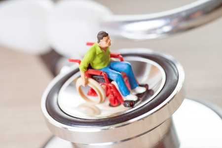 Wheelchair user and stethoscopeの写真素材