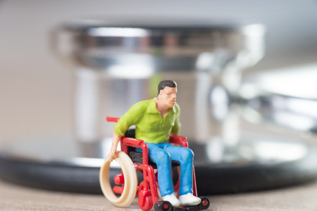 Wheelchair user and stethoscopeの写真素材