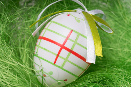 Easter egg in a easter nestの写真素材