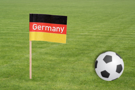 Soccer field with football and german flag with the word Germanyの写真素材