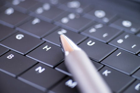 Computer keyboard with pen