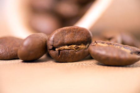 Coffee beans on a wooden boardの写真素材