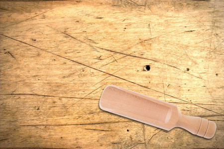 Dosing shovel over a wooden backgroundの写真素材