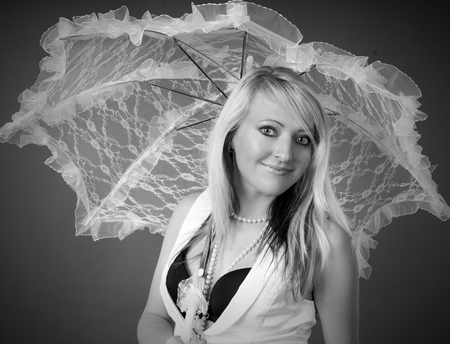 young woman with a umbrella in laceの写真素材