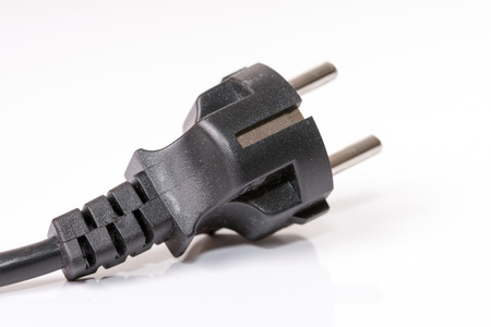 Power plug on a grey underground