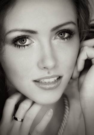 Portrait of a woman with brunette hair in black and whiteの写真素材