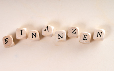 wooden cubes with the german word financeの写真素材