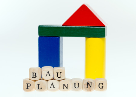 Wooden dice with the word construction planningの写真素材