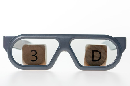 3D glasses and wooden cube with 3Dの写真素材