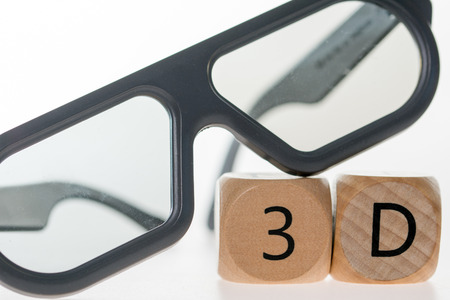 3D glasses and wooden cube with 3Dの写真素材
