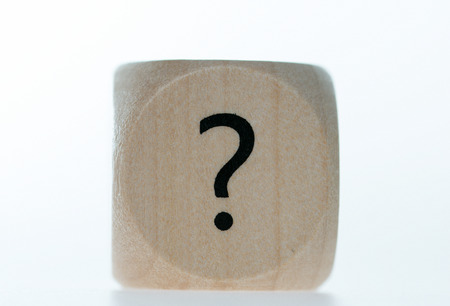 Wooden cube with a question markの写真素材