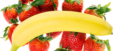 many Strawberries and one bananaの写真素材