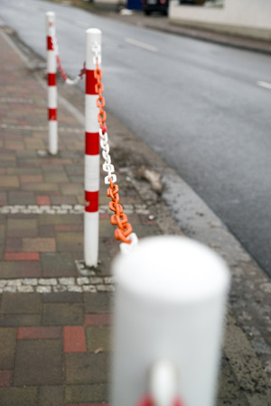 Barrier to a footpath beside a roadの写真素材