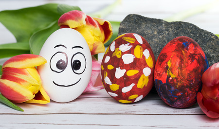 funny easter eggs and Tulipsの写真素材
