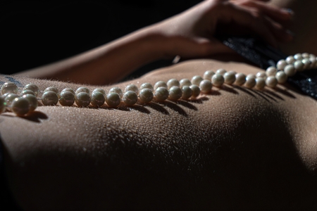 sexy woman with pearl necklaceの写真素材
