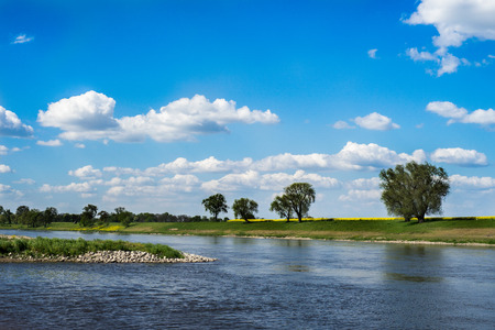 River and blue sky with cloudsの写真素材