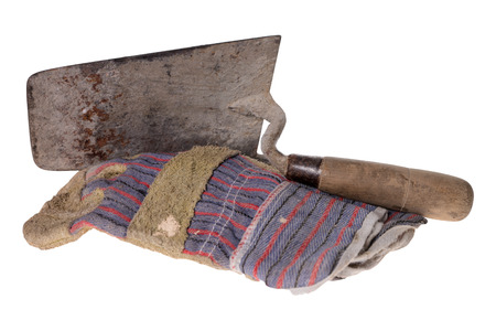 Brick trowel with work gloves isolated over a white backgroundの写真素材