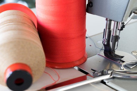 Sewing machine with yarn and scissorsの写真素材