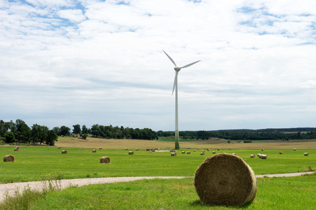 Wind turbine stands in an open spaceの写真素材