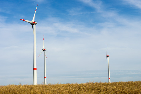 Wind turbine stands in an open space