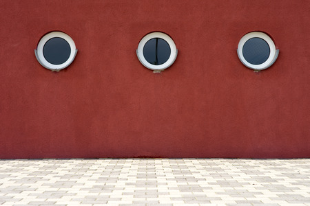round window in a red houseの写真素材