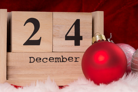 Christmas tree ornaments and wooden cubes with the date December 24