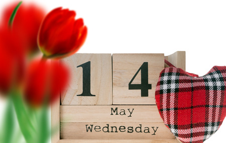 Wooden cubes with the date for Mothers Day and flowersの写真素材