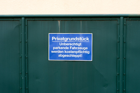 sign at a gate with the german words private propertyの写真素材