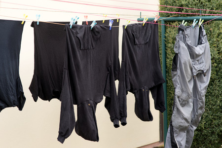 washed clothes on a clothes lineの写真素材