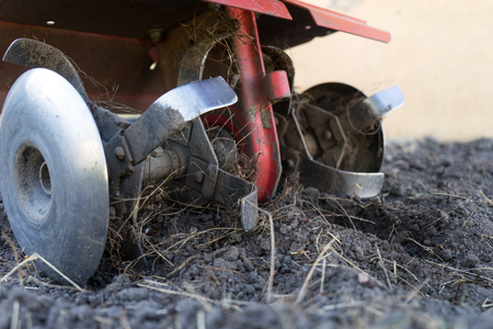 tiller to dig in a gardenの写真素材