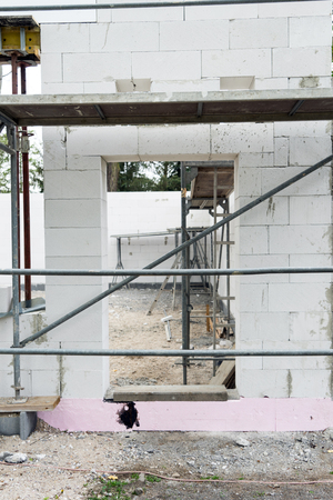 shell and scaffolding on a construction siteの写真素材