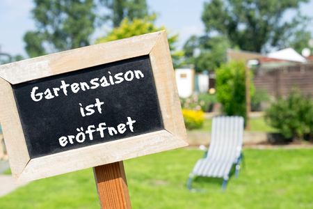 sign with the german words garden season is openedの写真素材