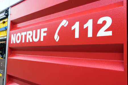 emergency service car with the german inscription Emergency call 112