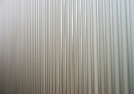corrugated iron plate in silver as backgroundの写真素材