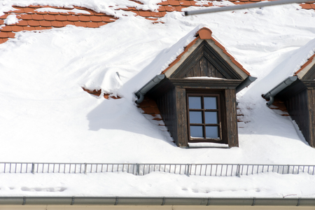 snow covered house roofの写真素材