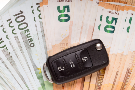 many bills and car keyの写真素材