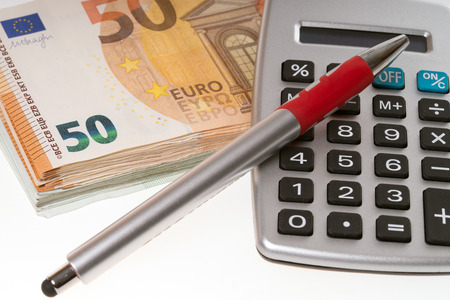 many euro banknotes and calculatorの写真素材