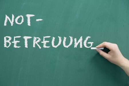 Chalk board with the German words emergency careの写真素材