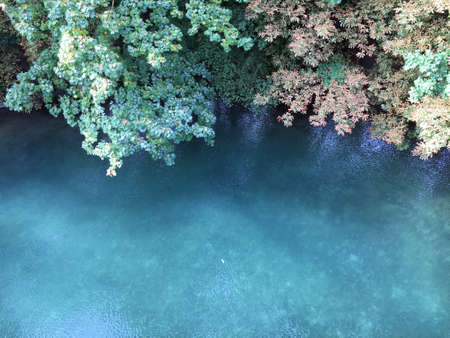 The lowland river in ZÃ¼rich flows slowly towards the lake, Switzerland